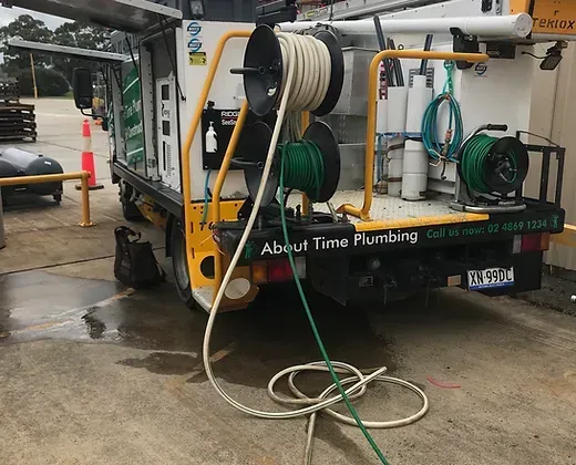 Back Of Truck With Hoses— About Time Plumbing & Civil Construction in Moss Vale, NSW