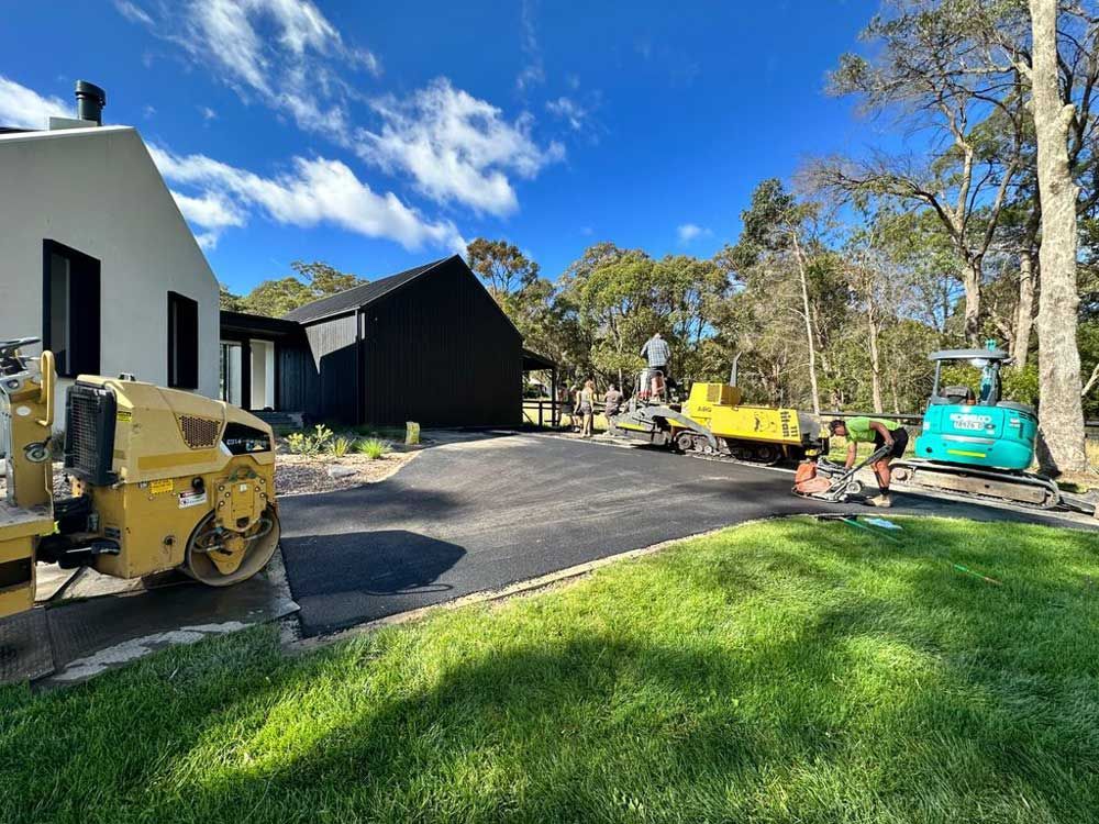 Final Touch on Newly Installed Pavement — About Time Plumbing & Civil Construction in Moss Vale, NSW