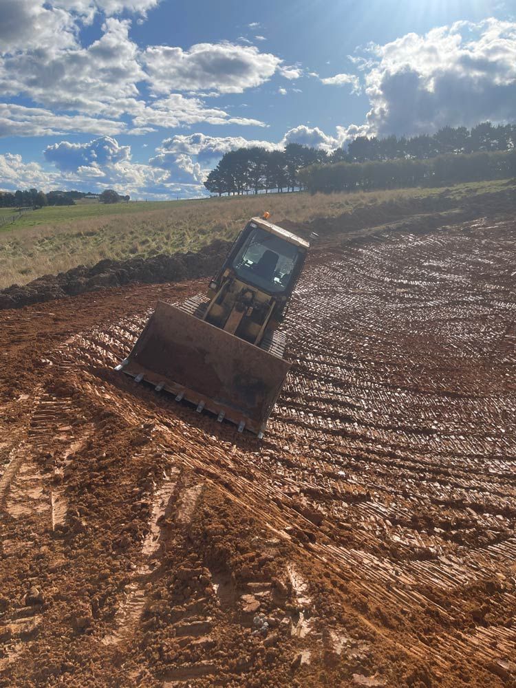 Excavator in Dam — About Time Plumbing & Civil Construction in Moss Vale, NSW