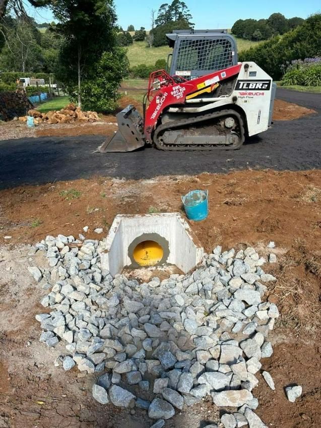 White and Red Excavator — About Time Plumbing & Civil Construction in Moss Vale, NSW