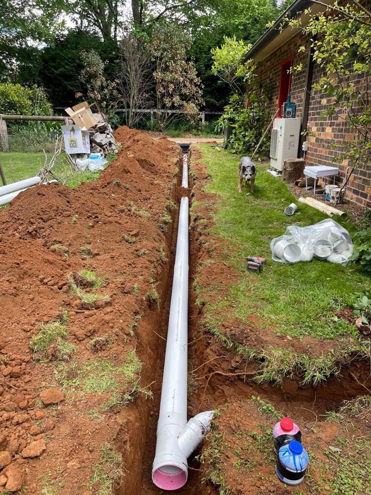 White Long Pipe — About Time Plumbing & Civil Construction in Moss Vale, NSW