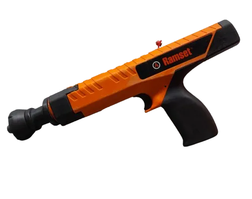 Orange and black Ramset powder-actuated tool with power adjustment and rubber grip.