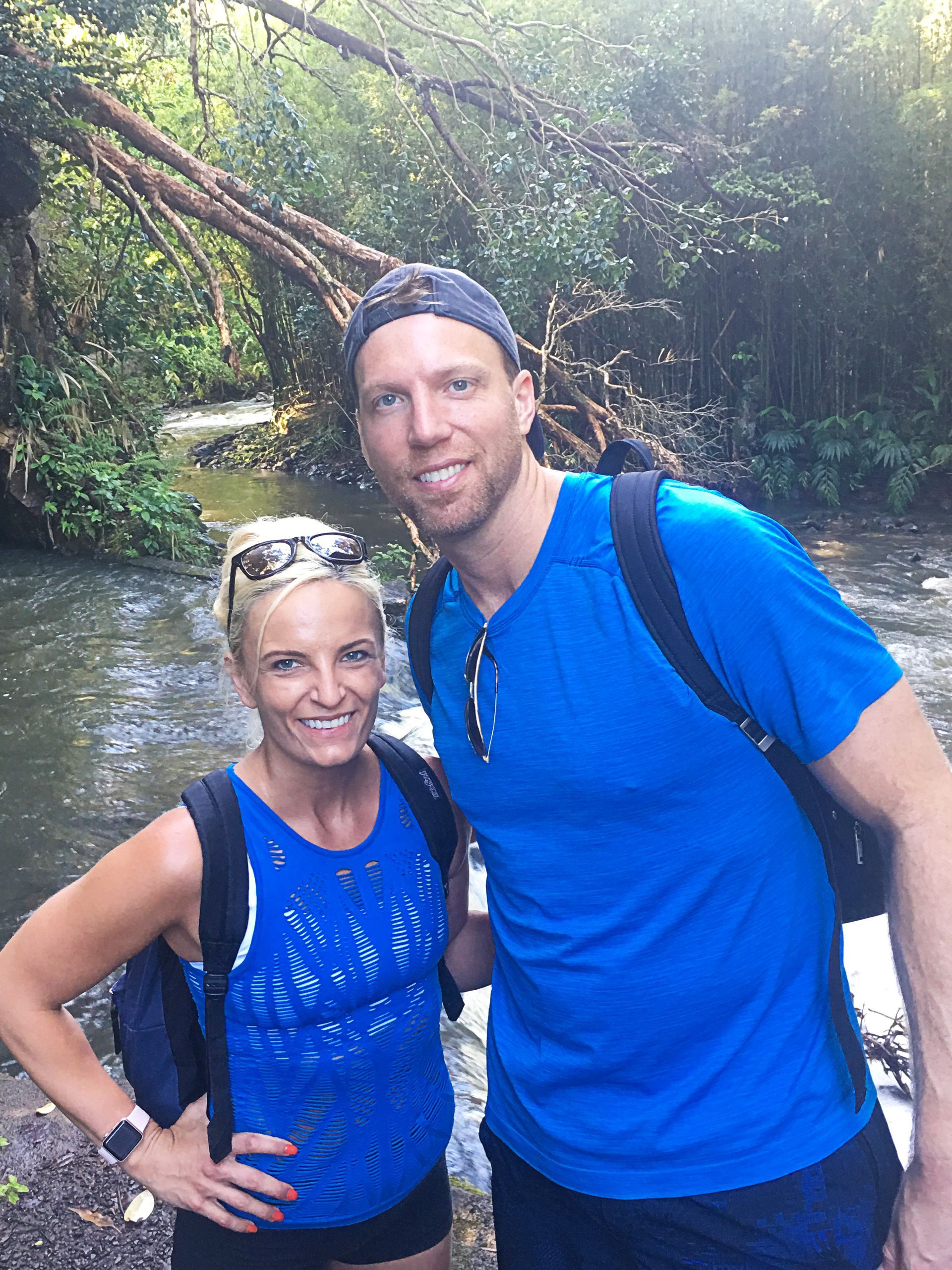 An image of Drew and Anna Jerdan hiking in the wilderness.