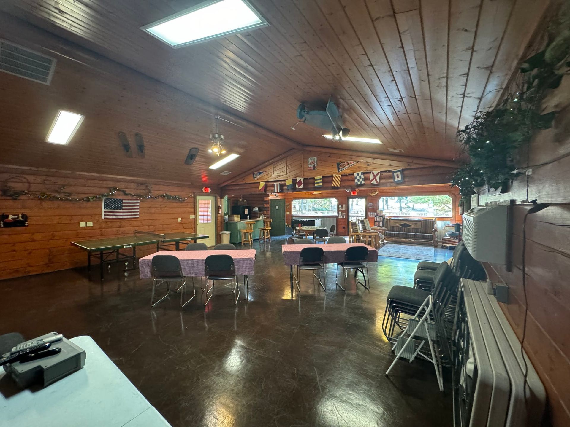 A large room with tables and chairs in it.