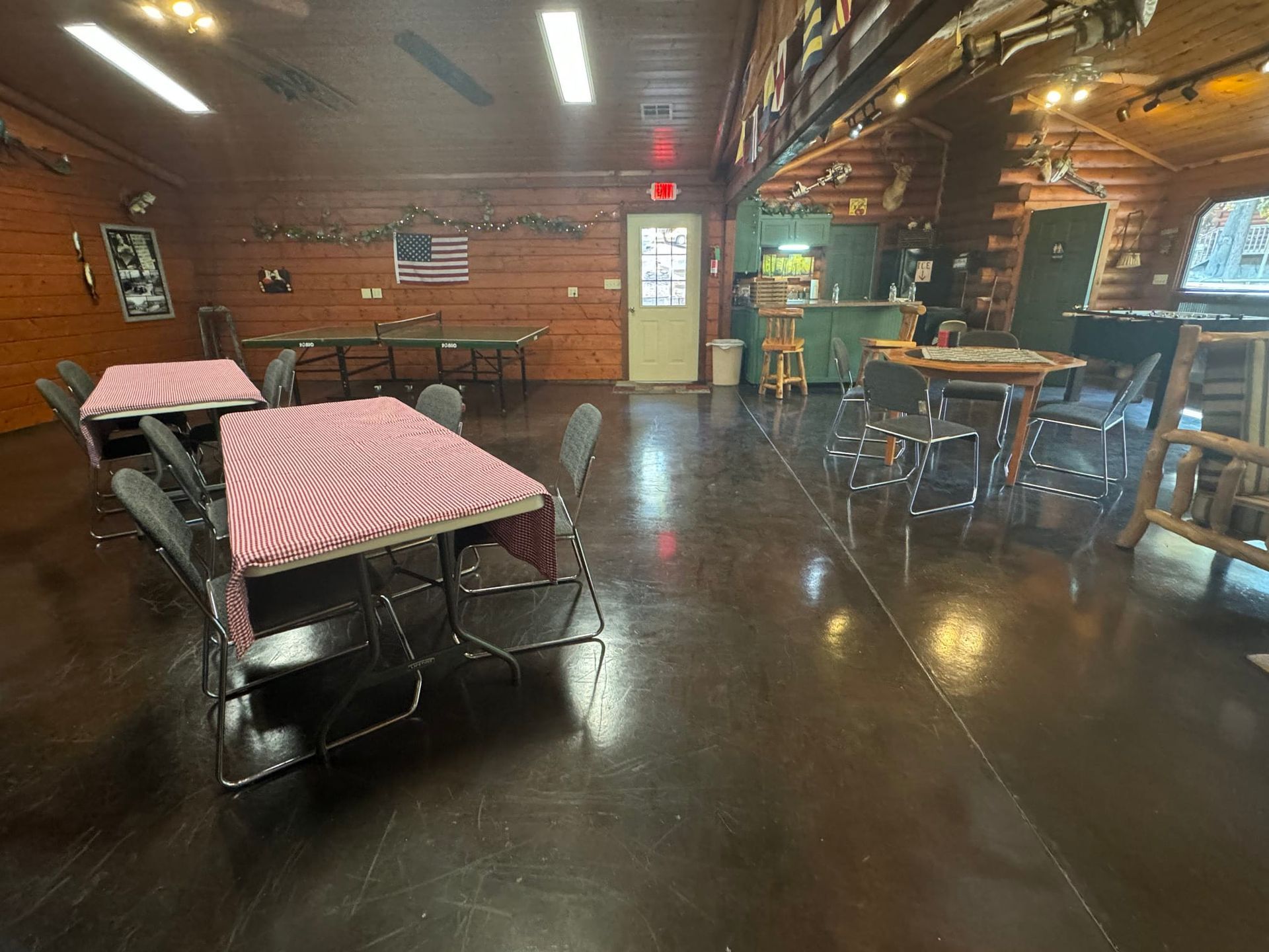 A large room with tables and chairs in it.