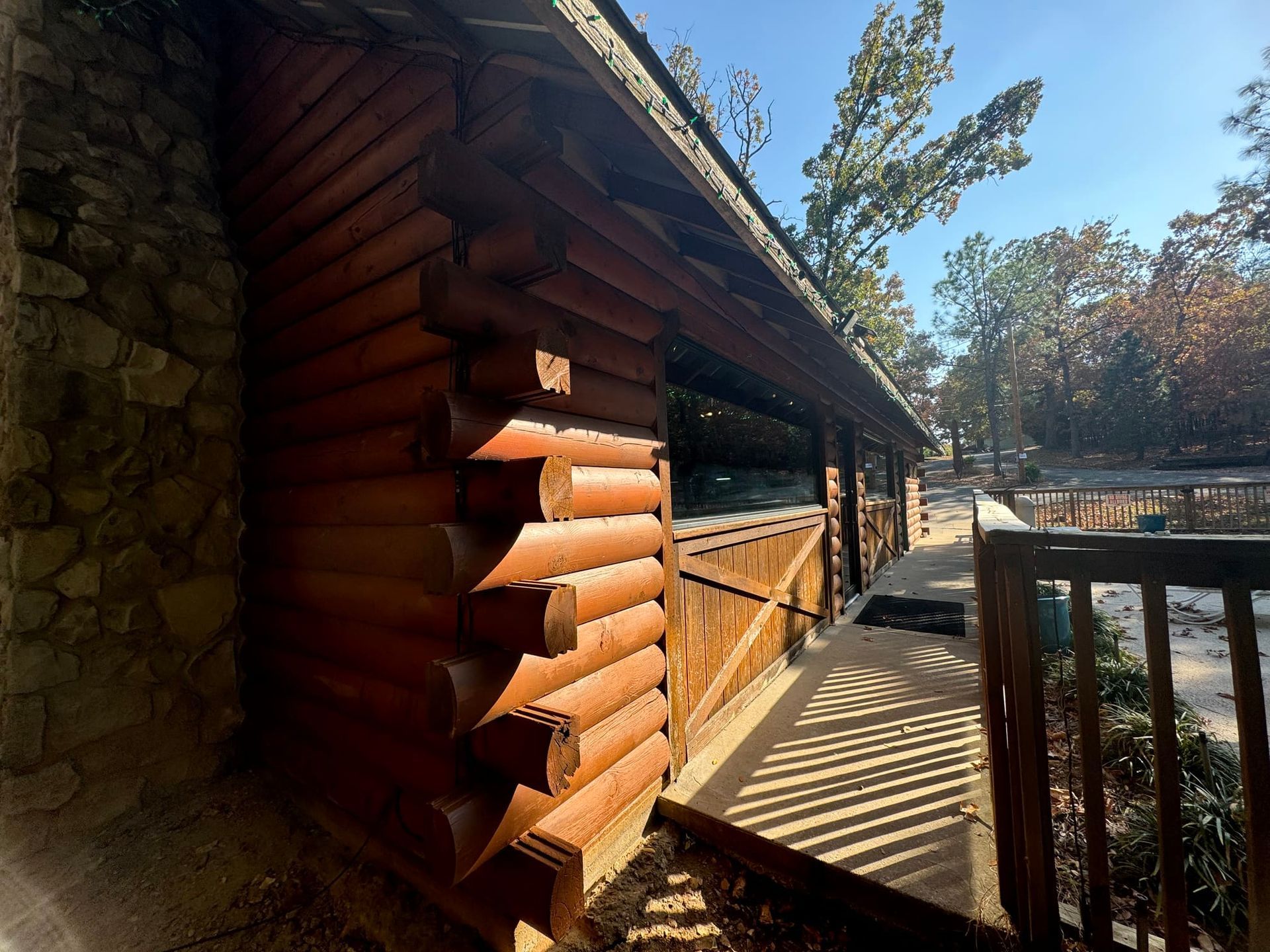 A log cabin with a wooden walkway leading to it