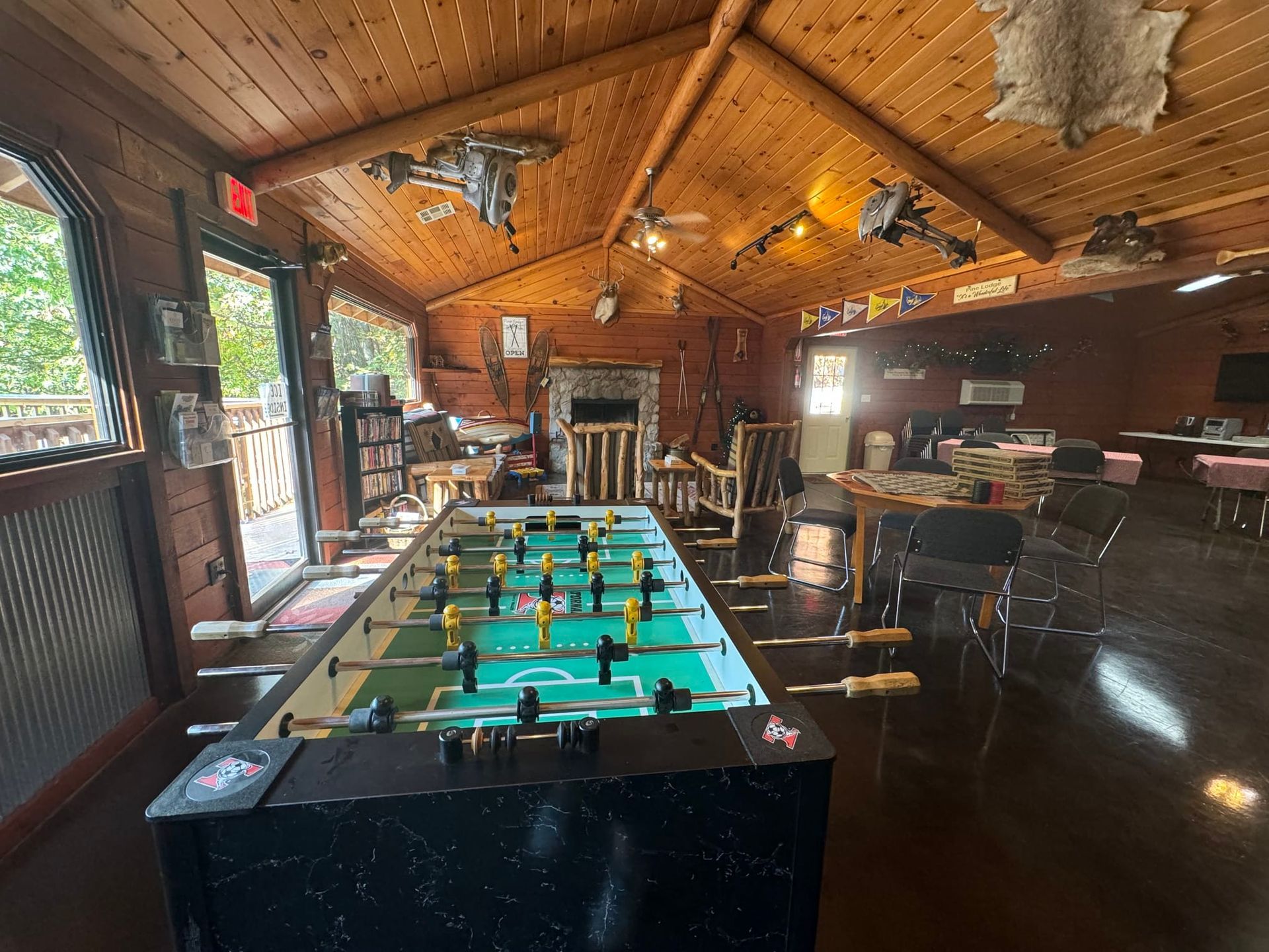 There is a foosball table in the middle of the room.