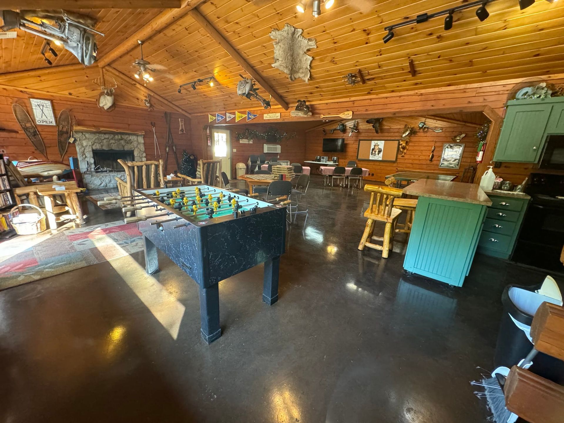 There is a foosball table in the middle of the room.