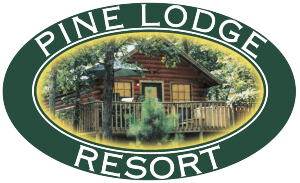 Pine lodge resort logo with a log cabin in the background