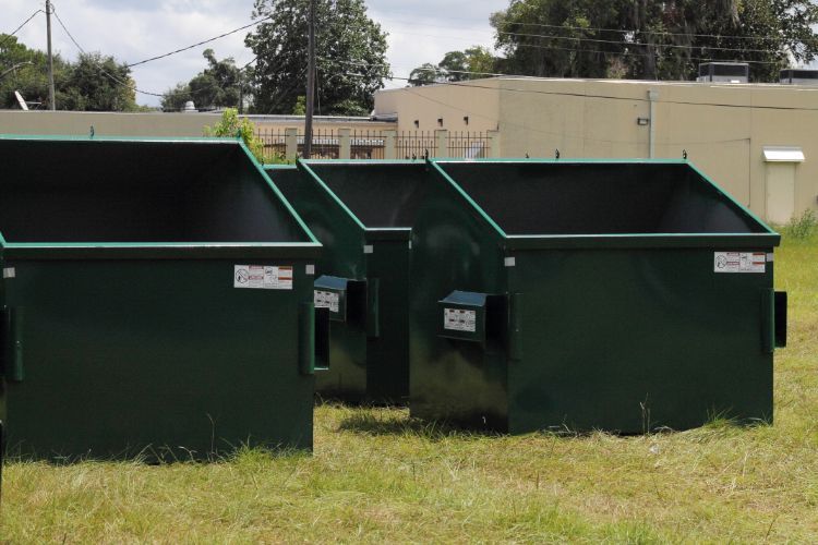 green empty dumpsters