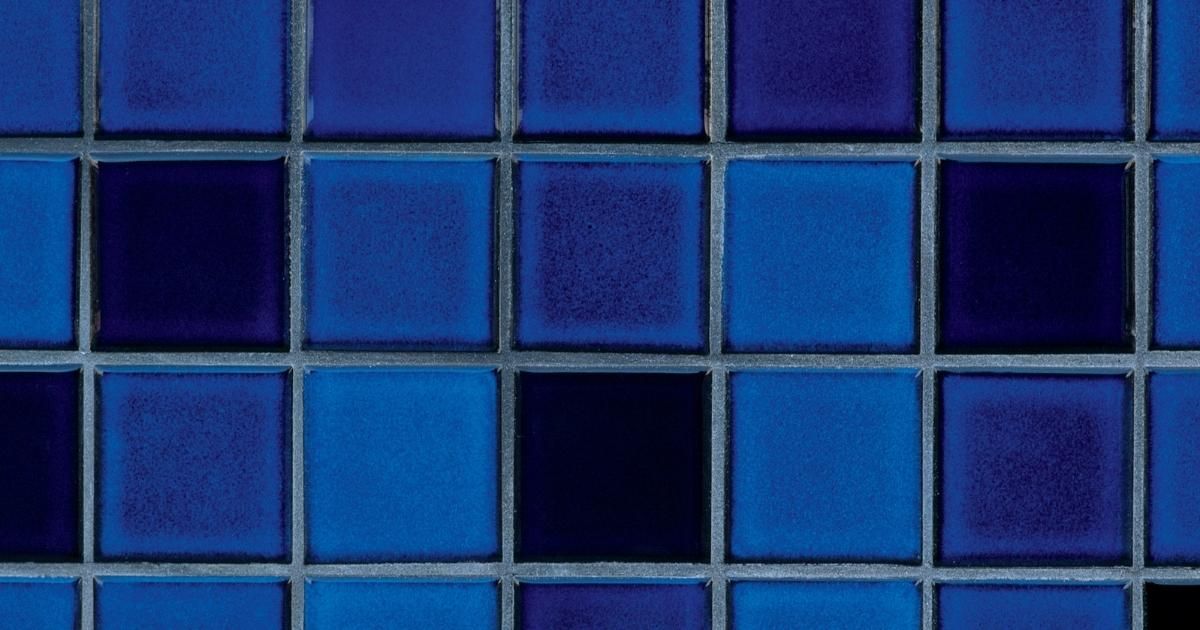 Variated blue tiles in a pattern.