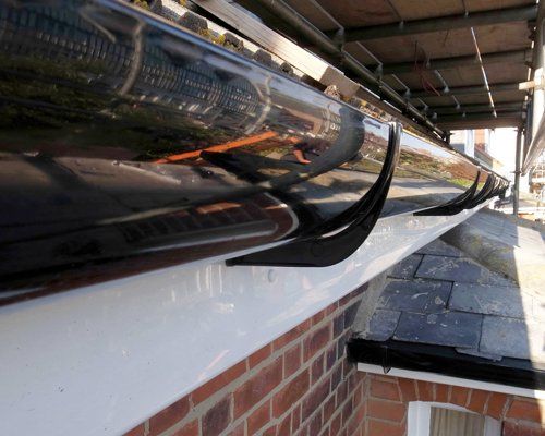 A digital image of a UPVC black extra wide or super-flo guttering.