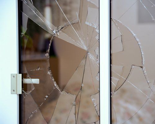 Close up of broken glass in window