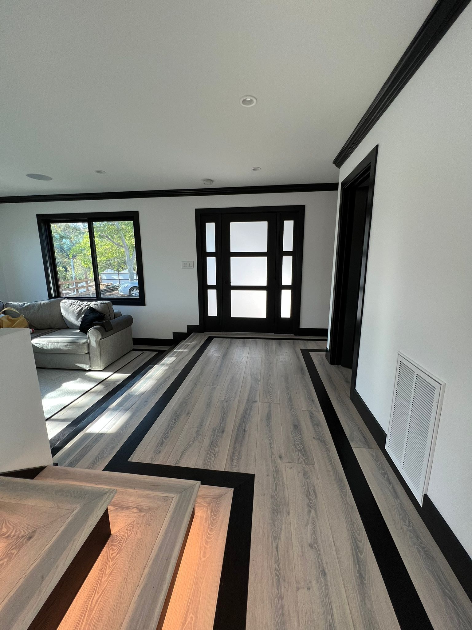 A living room with a couch and a door