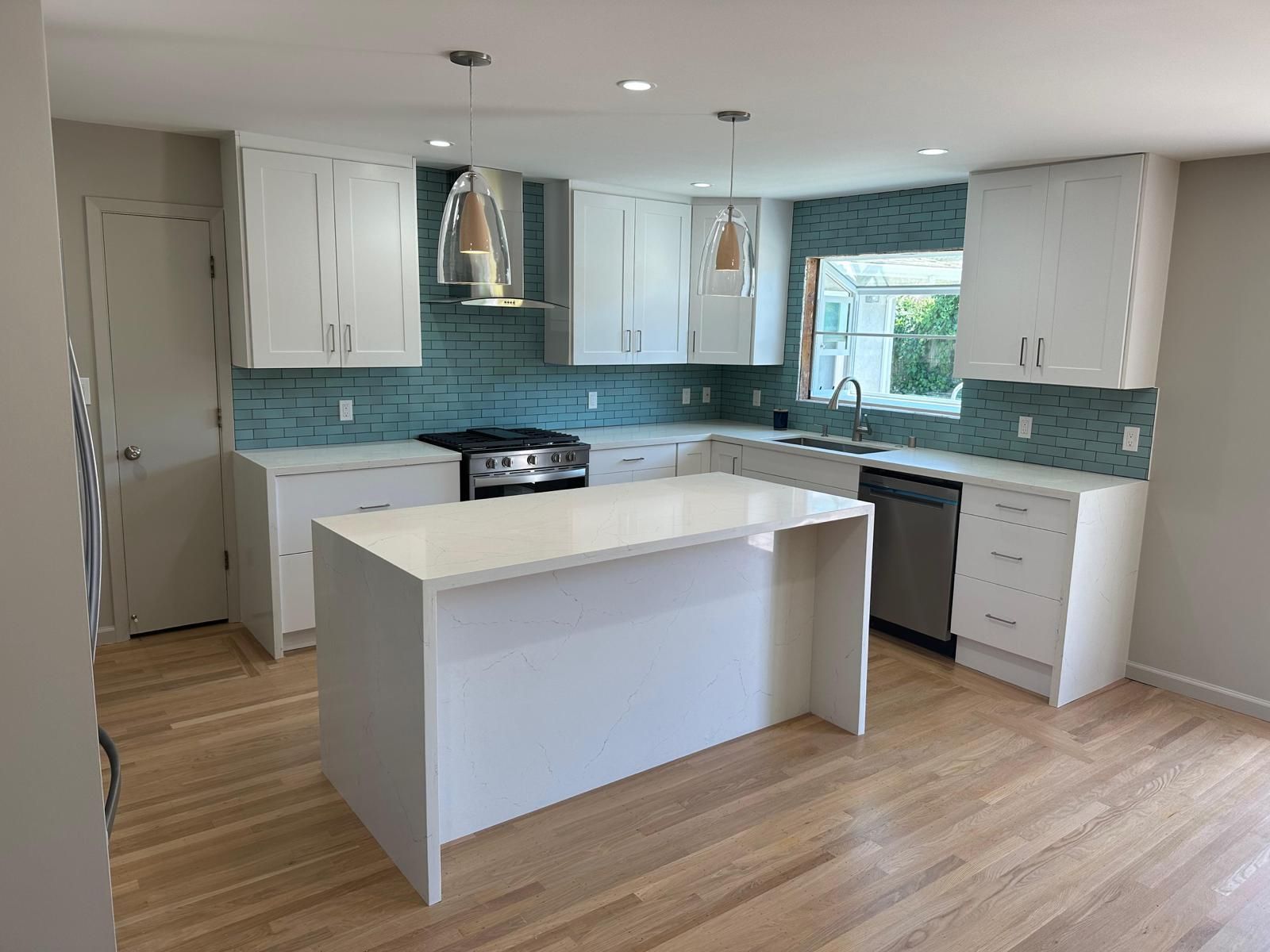 There is a large island in the middle of the kitchen.