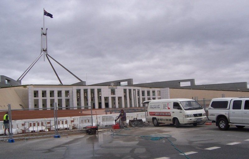 Workers working on the exterior concrete floor