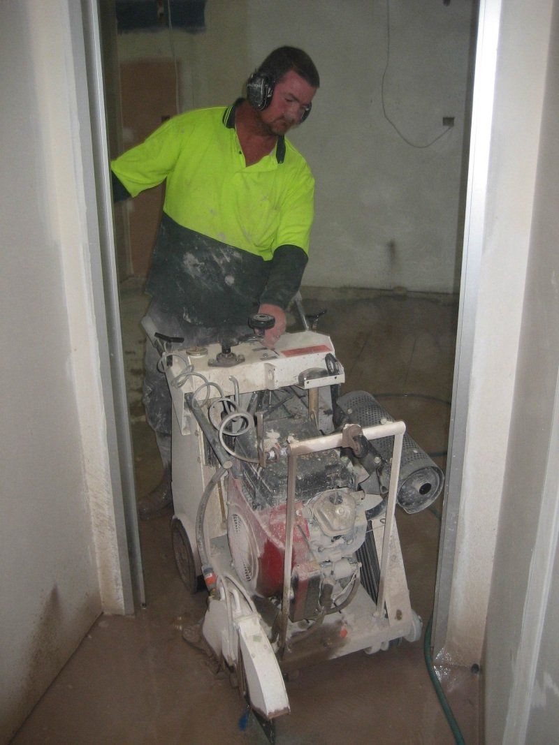 contractor taking the machine out of the room
