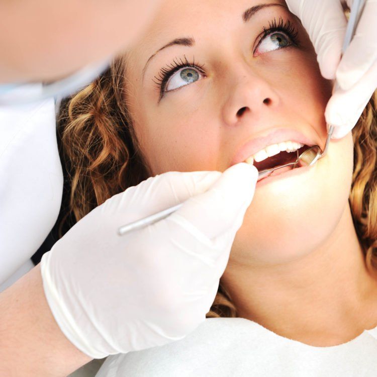 Cosmetic Dentistry - woman at the dentist