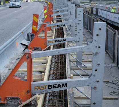 A row of Axxium's Suspend Access Solution product Fast Beam™ barriers on the side of a road.