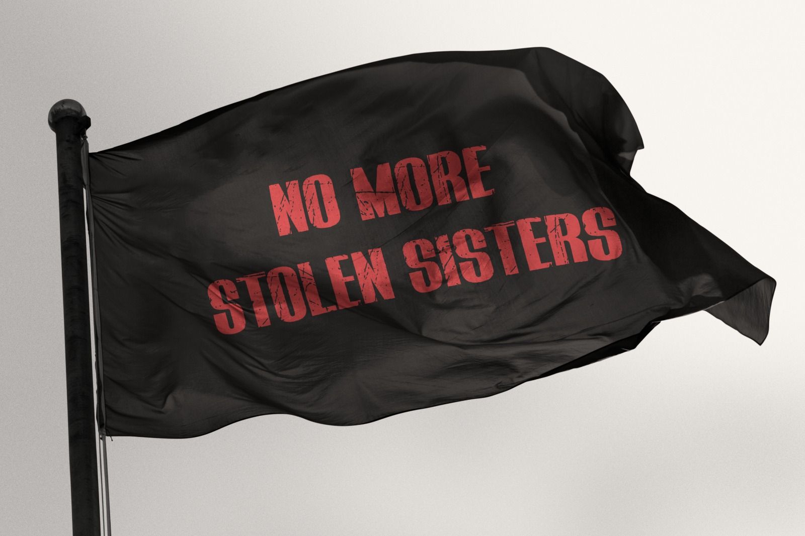 A black flag that says no more stolen sisters