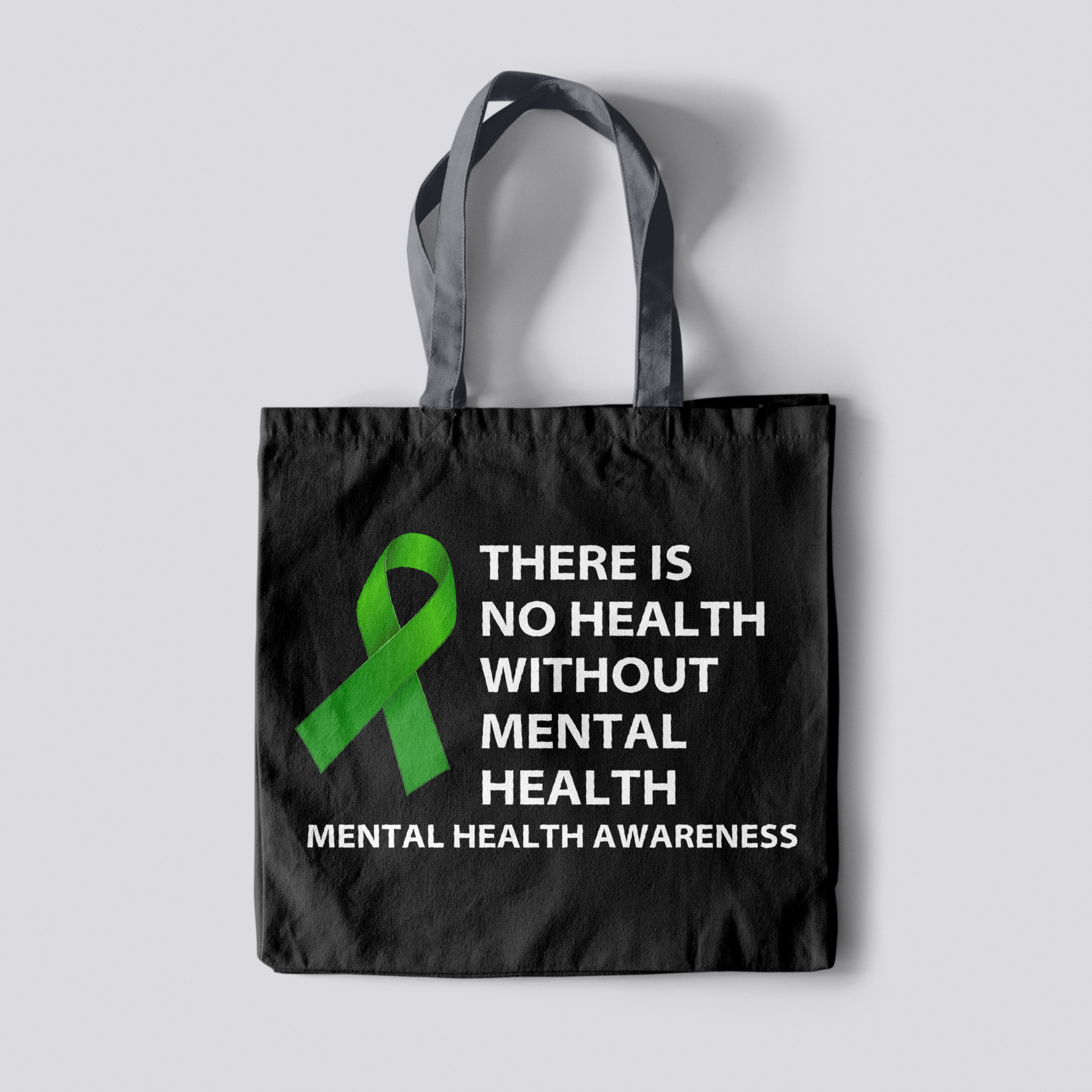 A black tote bag that says there is no health without mental health mental health awareness