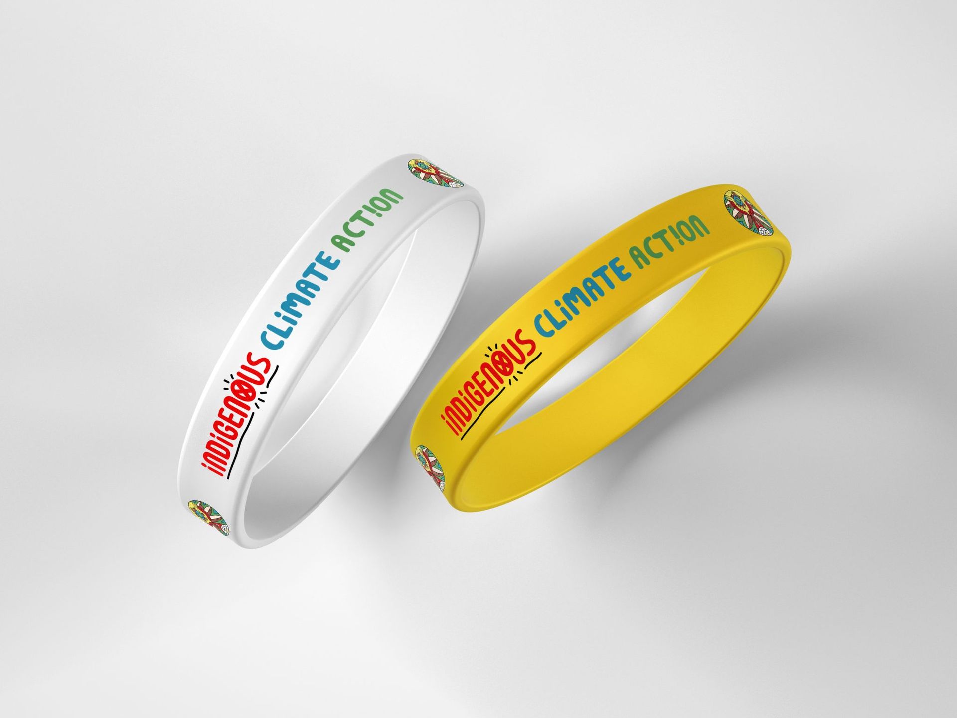 Two bracelets that say climate action on them