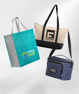 Three bags are sitting on top of each other on a white surface.