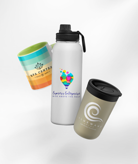 A water bottle a mug and a coffee cup are sitting on a table.