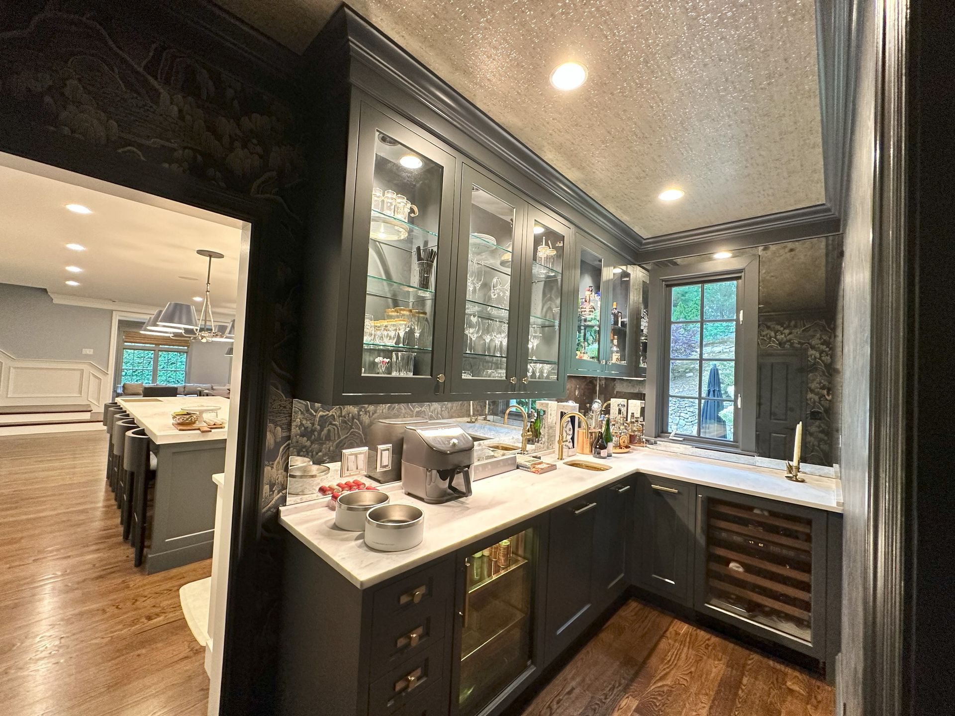A kitchen with a lot of cabinets and a refrigerator