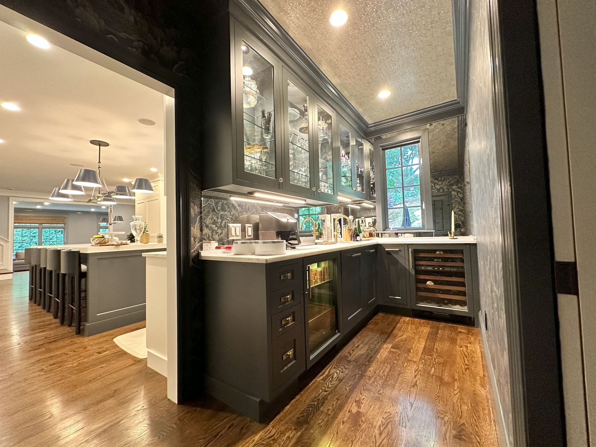 A kitchen with a lot of cabinets and a refrigerator.