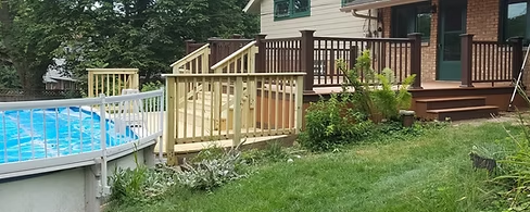 A house with a swimming pool and a deck in the backyard.