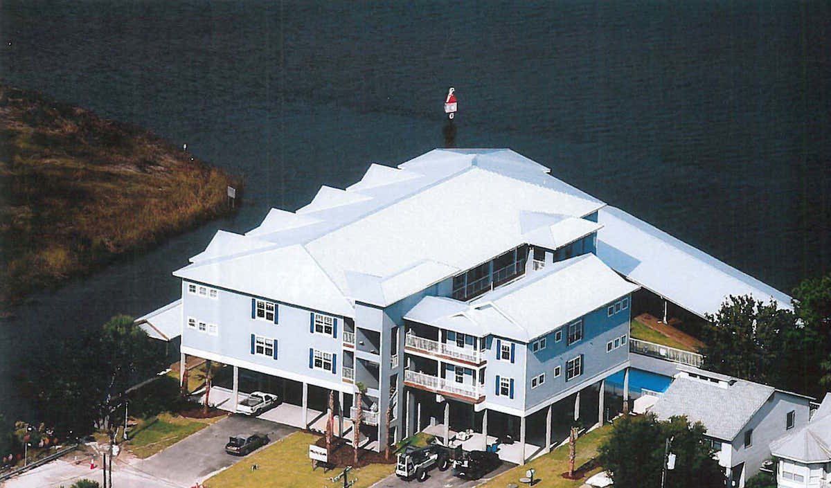 Large, three story commercial space at Suwannee Pointe with blue shutters