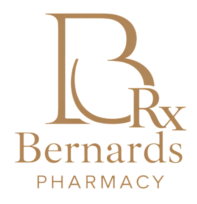 Wharton Pharmacy sign: white text on a teal rectangle with a decorative border.