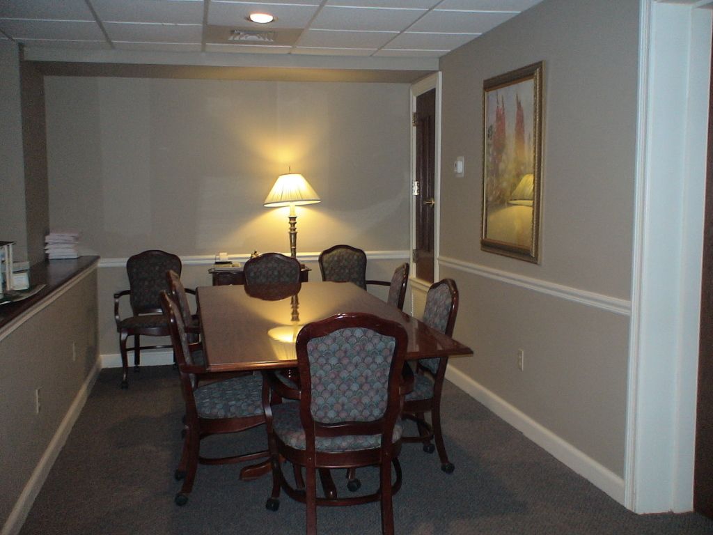 Eight (8) images of other parts of the facility at Hatmaker Funeral Home in Rocky Top, TN. Seating area