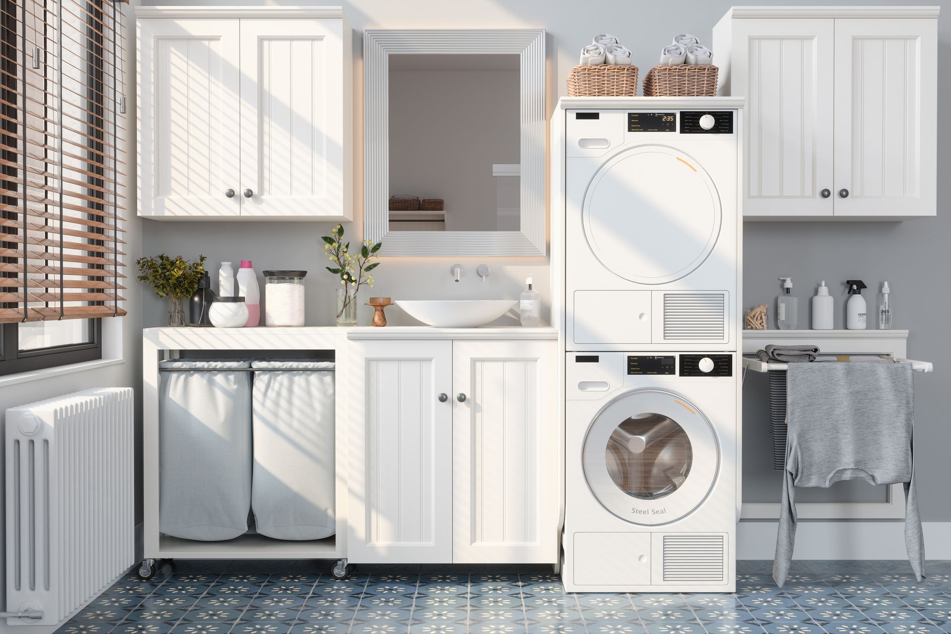 White laundry room with washer, dryer, cabinets, and laundry hamper.
