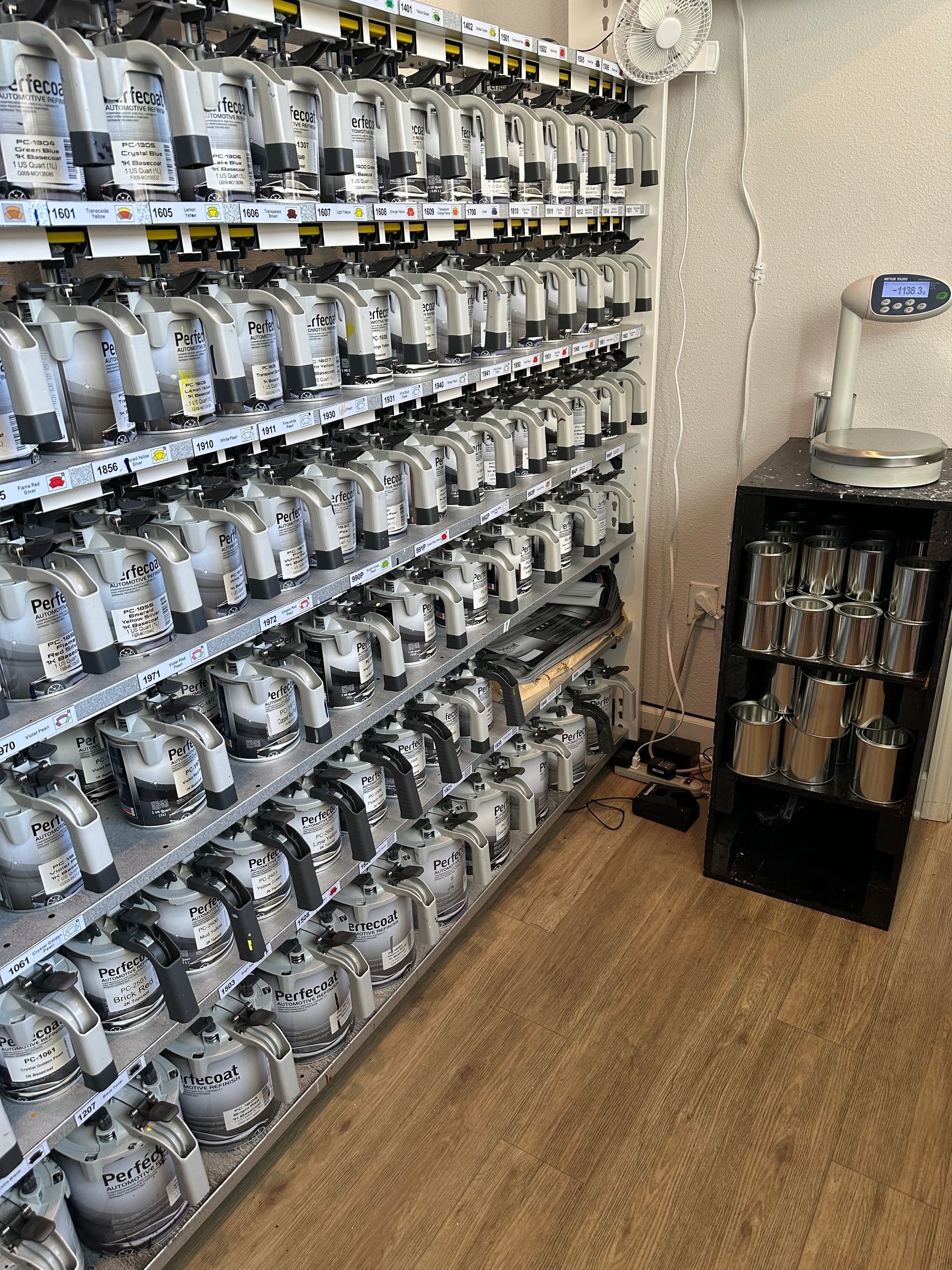 A store shelf filled with lots of boxes of motorcycle parts.