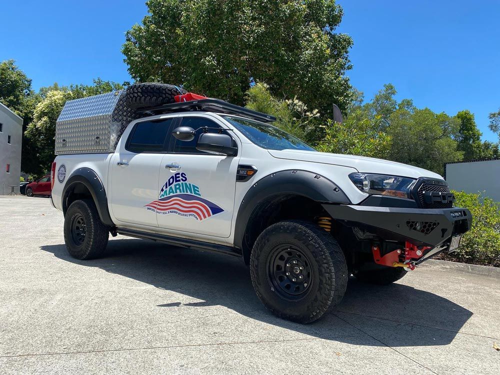4WD with Canopy and Roof Racks  Installed— About Us in Noosaville QLD