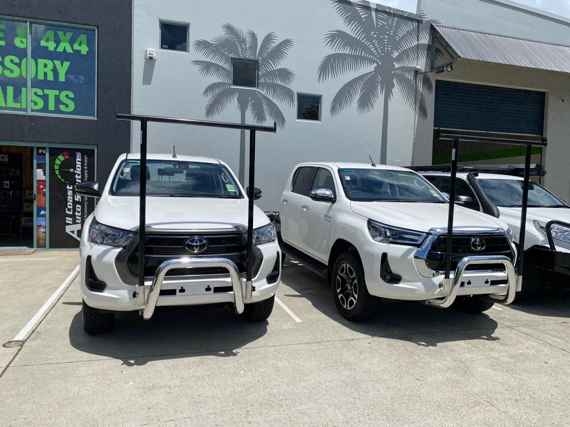 Two White Utes with Nudge Bar & Ladder Racks— Truck Accessories in Noosaville QLD