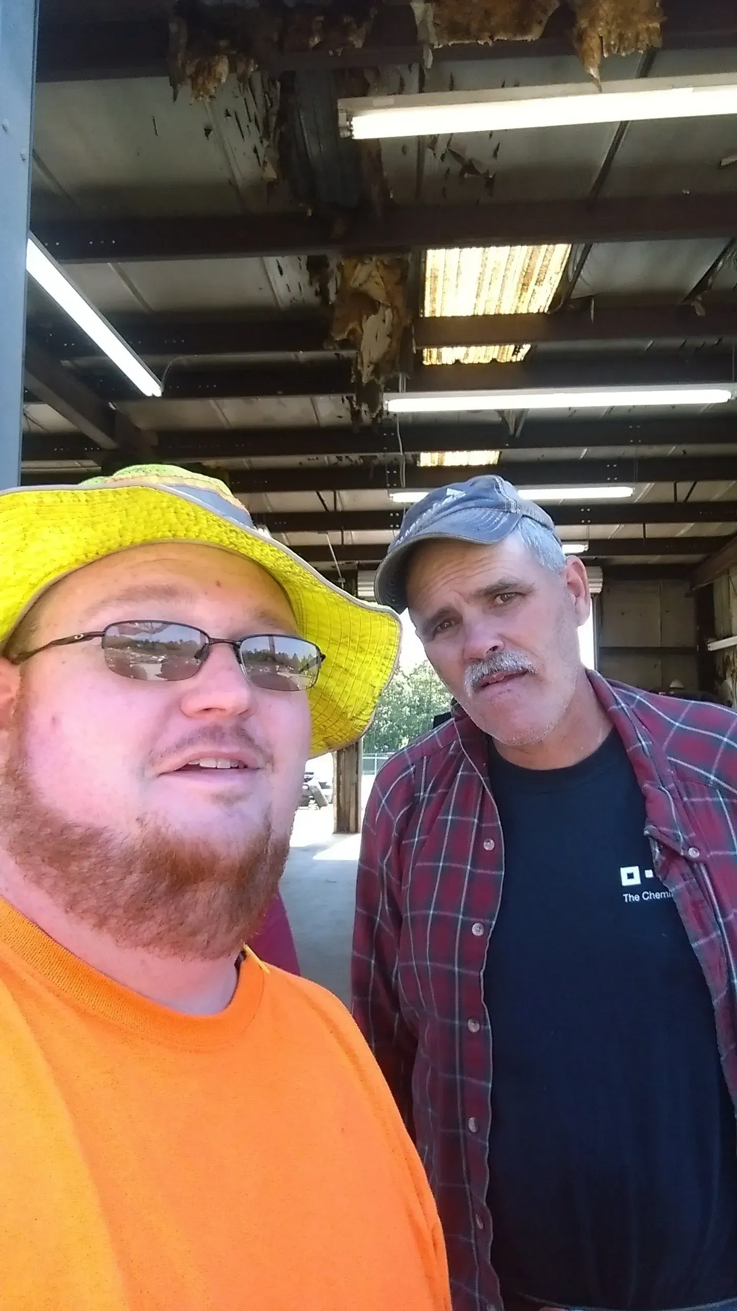 Two men are posing for a picture.