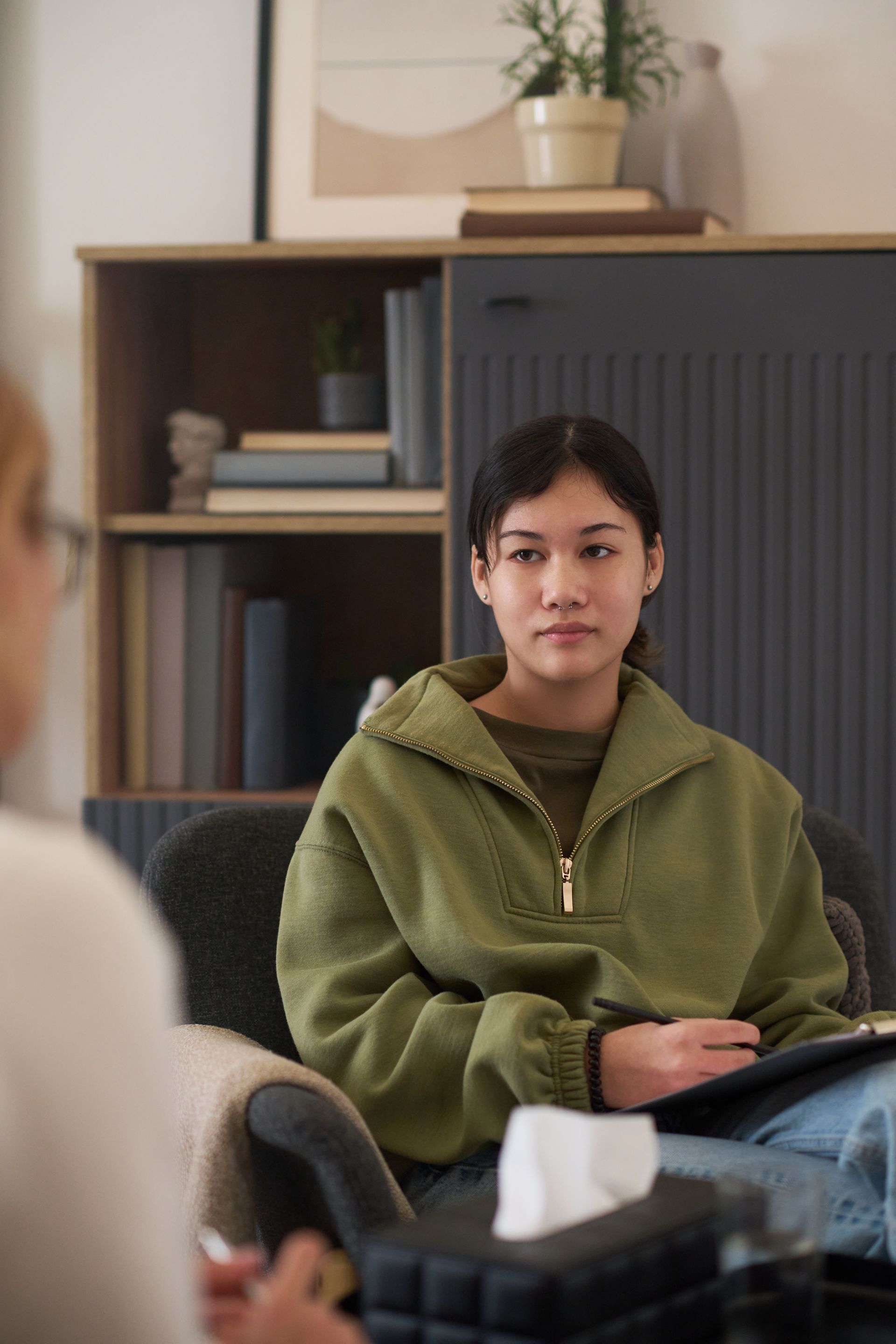 Person speaking with a legal professional in a calm and supportive setting