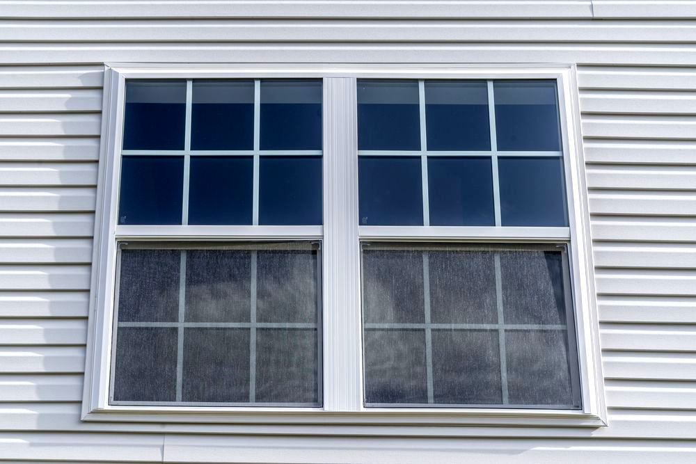 A Close Up Of A Window On The Side Of A House — A & C Classic Window Tinting In Maitland Vale, NSW