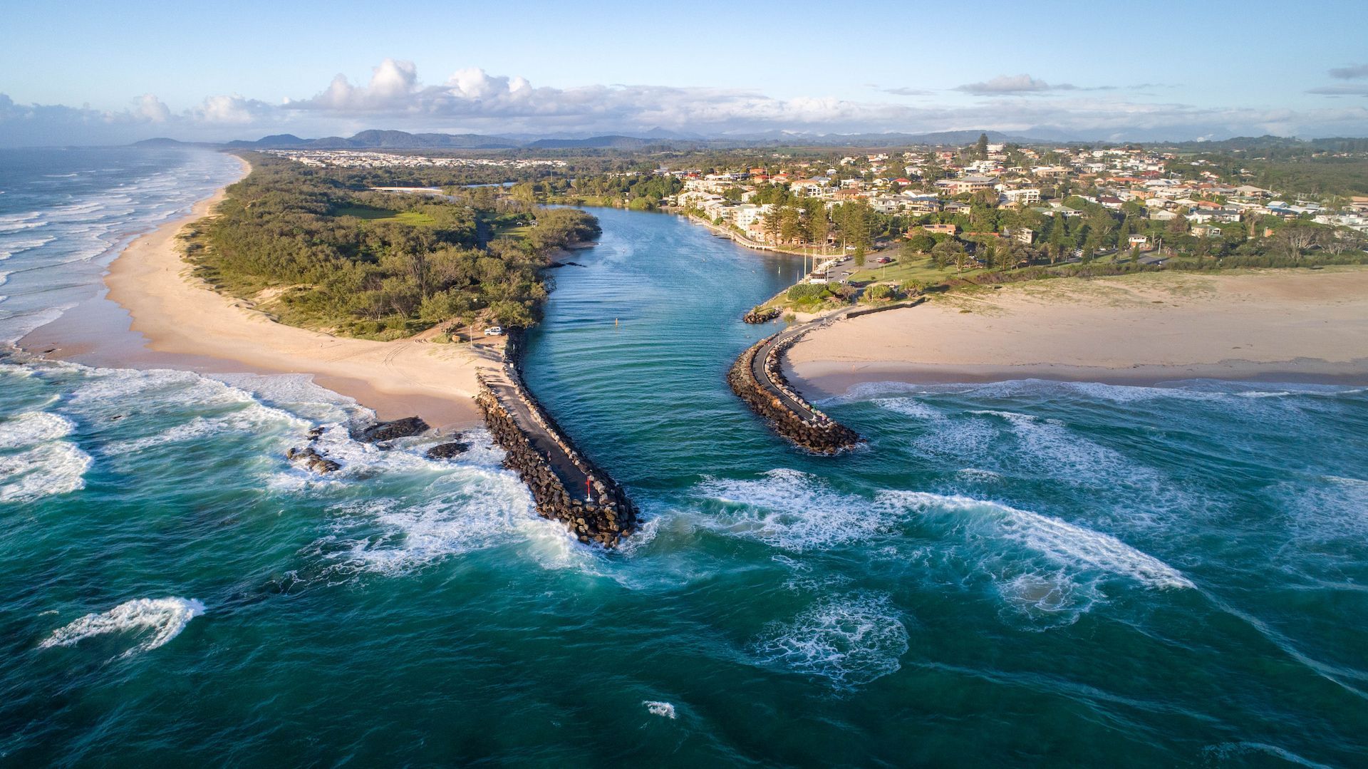Aerial View of a River Mouth Meeting the Ocean, Flanked by Sandy Beaches and a Coastal Town — Restoradrive in Kingscliff, NSW