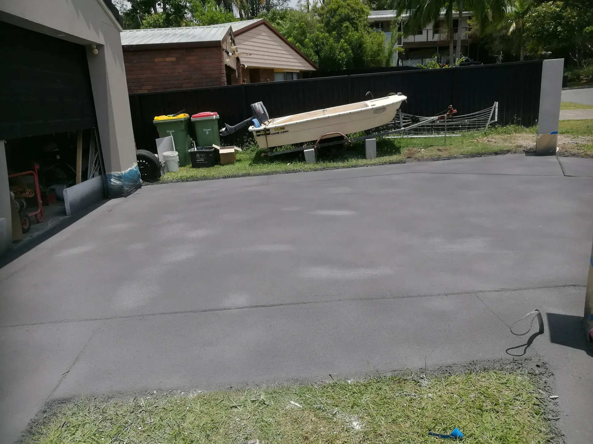 Person Pouring Asphalt Sealant Onto a Driveway — Restoradrive in Banora Point, NSW