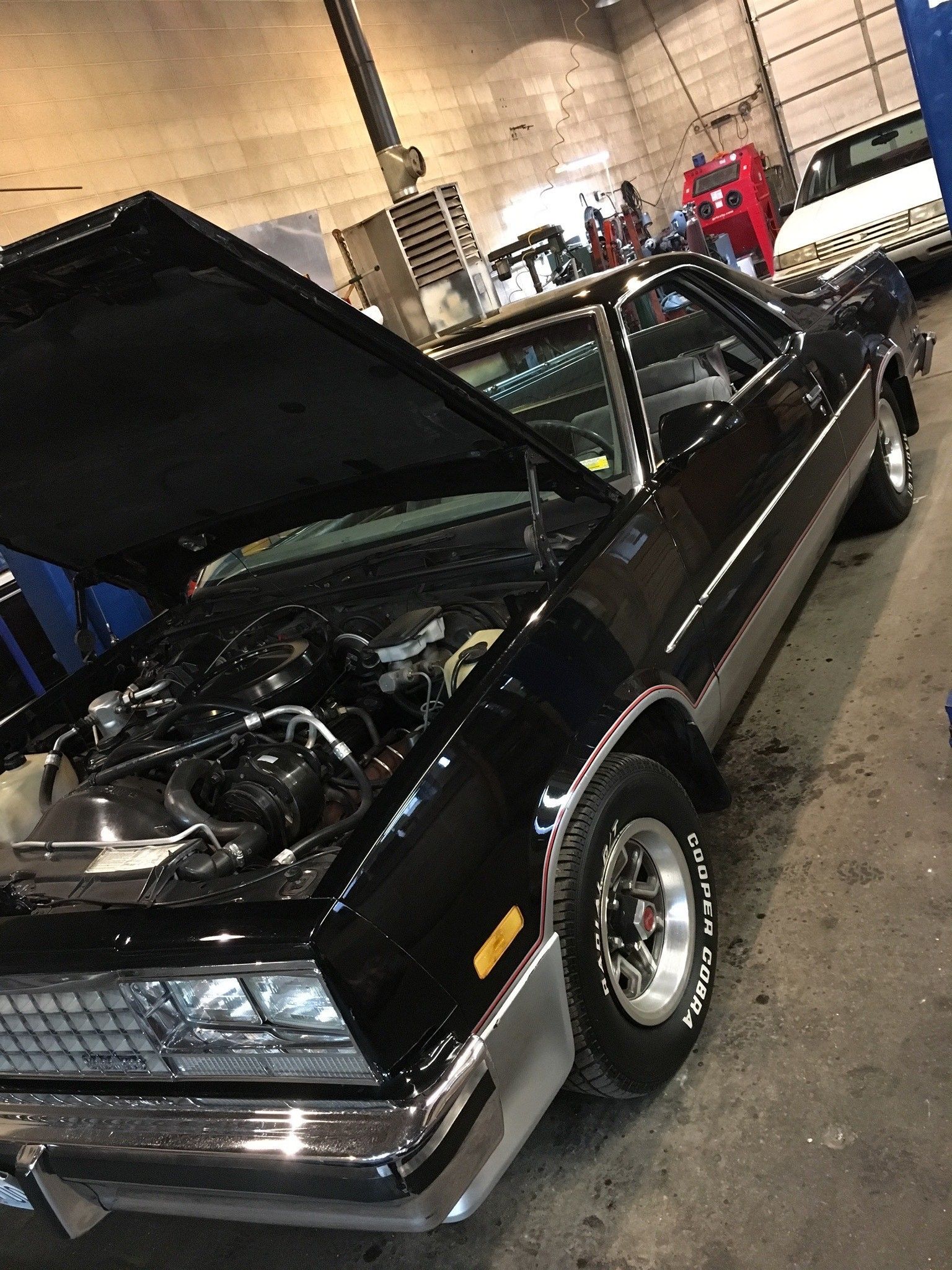 Man Fixing Car — Springfield, MO — Loveland's AOK Transmission Company