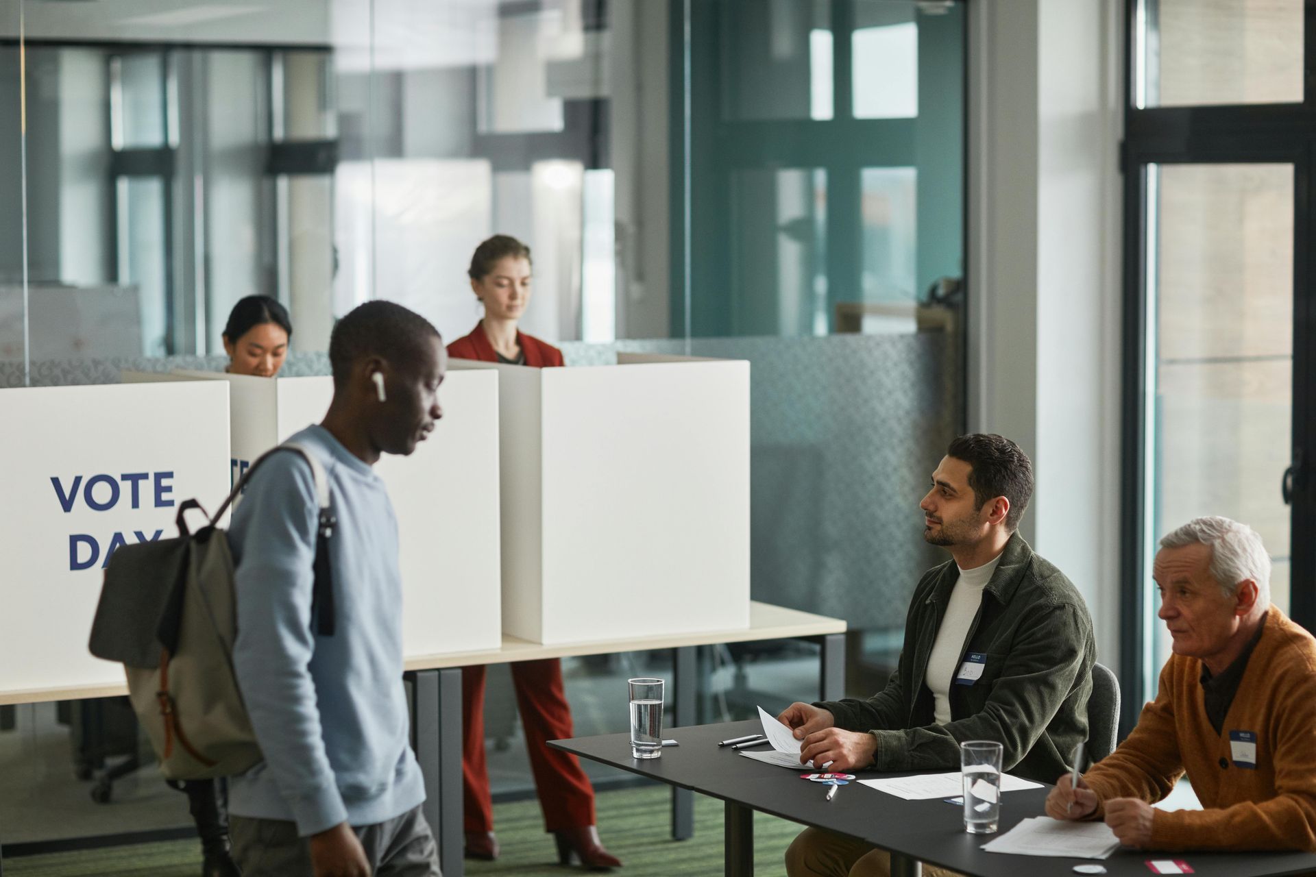 A group of people are sitting at a table in a room.