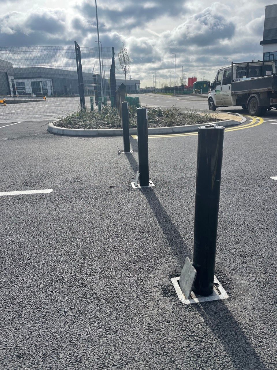 A parking lot with a truck parked in the background.