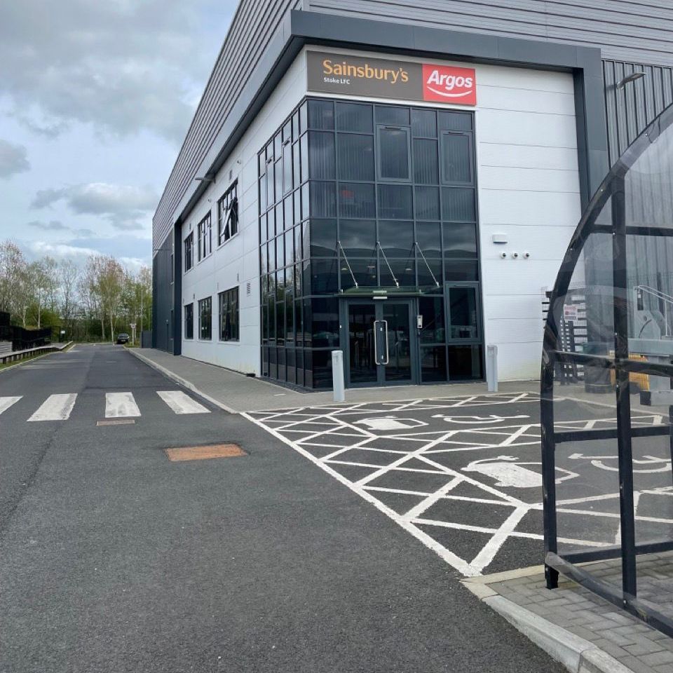 A large building with a sign that says sainsbury 's argos