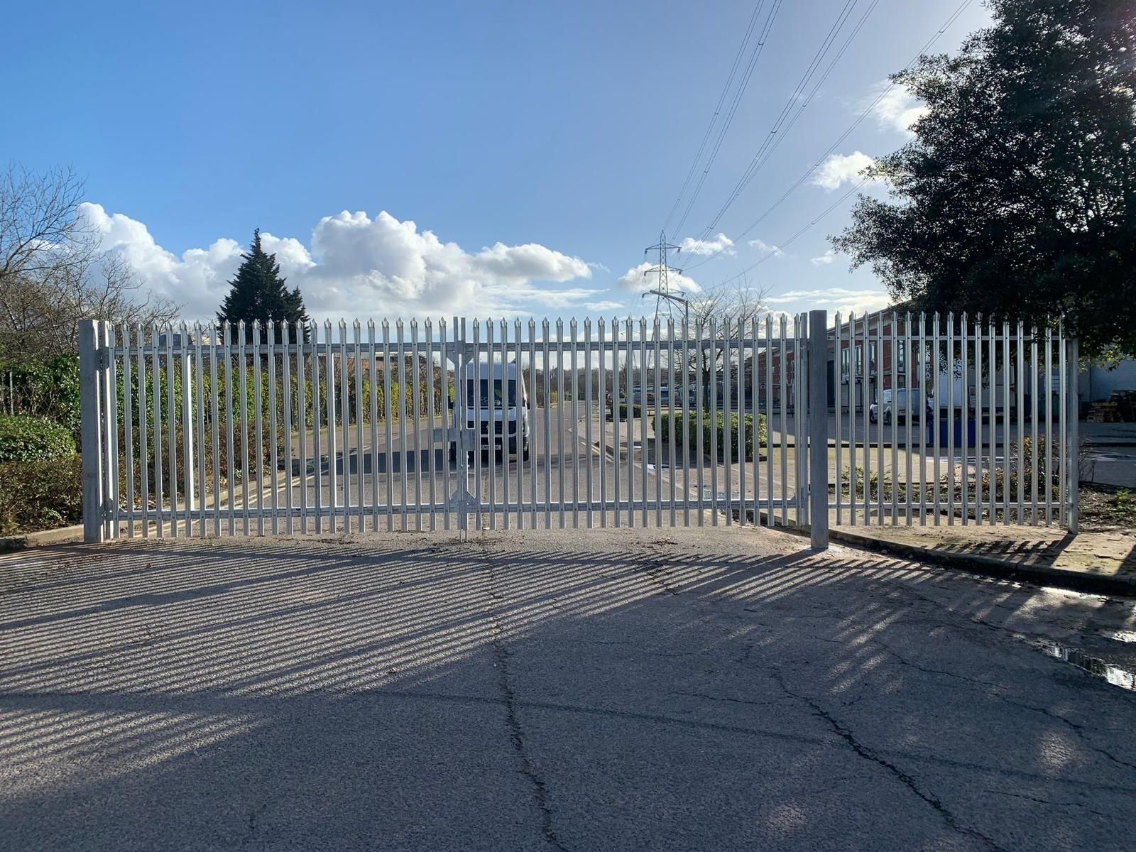 A fence with a blue sky in the background