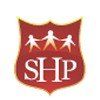 The logo for the salvation army is a red shield with three people holding hands.