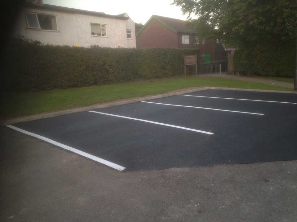 A parking lot with a white line in the middle of it